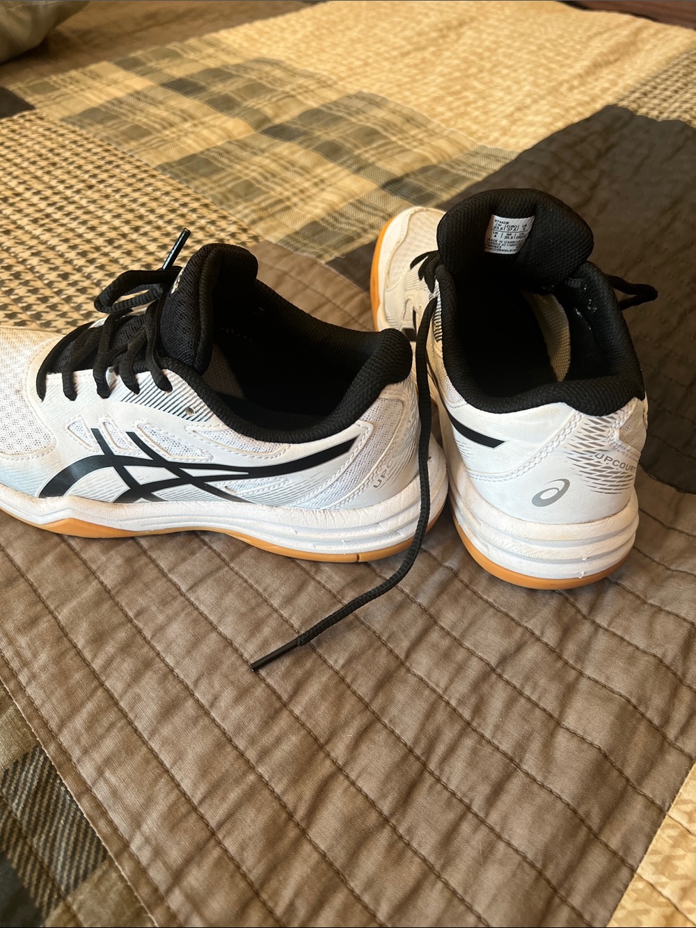 ASICS women’s kid’s White and Black Athletic Trainers with Gum Sole